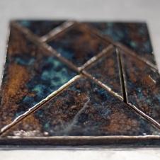 Keraaminen Tangram-palapeli.